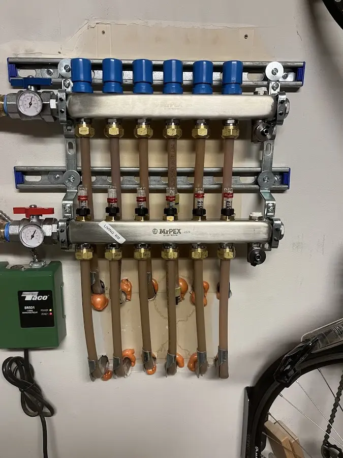 Plumber performing Gas Leak Detection at a residential property in Paris